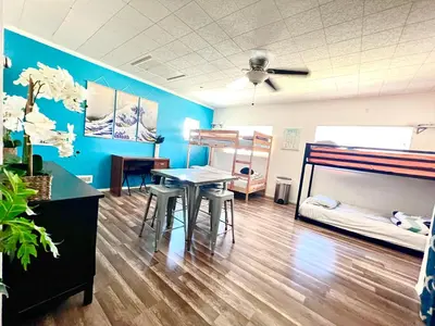 a room with two bunk beds and a table at WHOLE Family - Rosemont in Sacramento