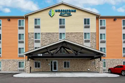 a wyncote hotel with a car parked in front of it at WoodSpring Suites Reno Sparks in Sparks