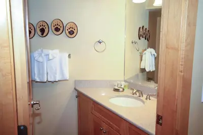 a bathroom with a sink and a mirror at Sierra Park Villas 20 in Mammoth Lakes