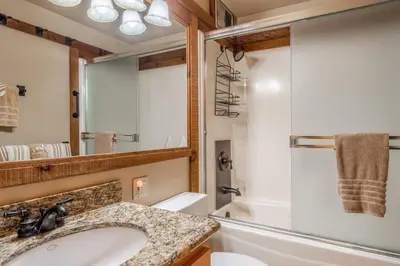 a bathroom with a sink and a shower at Northstar - Ski View Condo in Truckee