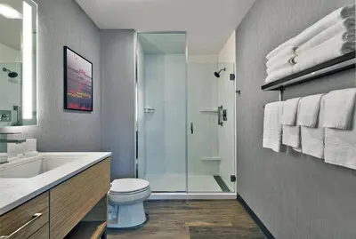 a bathroom with a shower and a toilet and a sink at TownePlace Suites by Marriott Sacramento Elk Grove in Elk Grove