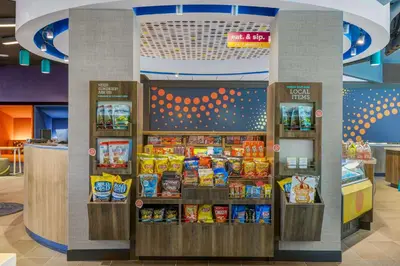 a store with a display of food and snacks at Tru By Hilton Lathrop in Lathrop