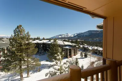a view from the balcony of a resort in the snow at Sunstone Lodge by 101 Great Escapes in Mammoth Lakes