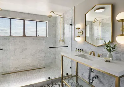 a bathroom with a sink and a mirror at The Darling in Visalia