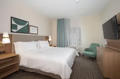 a hotel room with a bed and a television at Staybridge Suites - Carson City - Tahoe Area by IHG in Carson City