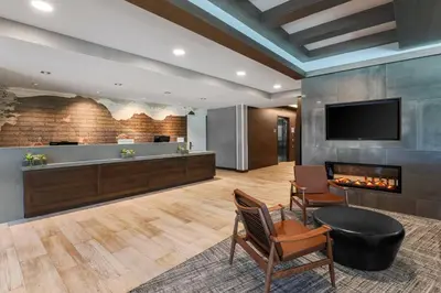 a lobby with a fireplace and a flat screen tv at SpringHill Suites by Marriott Truckee Lake Tahoe in Truckee