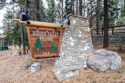 a sign for a holiday valley village in a park at Hidden Valley #104 condo in Mammoth Lakes