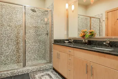 a bathroom with a shower and a sink at Solstice 24 in Mammoth Lakes