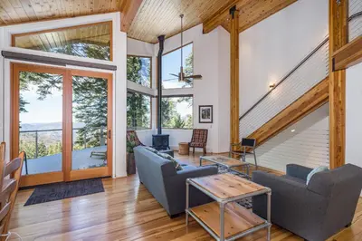 a living room with a couch and a table at Canyons Crest in Yosemite West