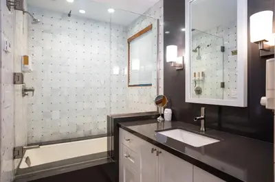 a bathroom with a sink and a bath tub at Cedar Crest - Eagle Cottage 8 in Homewood