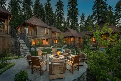 a house with a fire pit in the yard at Cedar Crest - Osprey Cottage 3 in Homewood