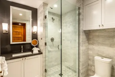 a bathroom with a shower with a toilet and a sink at Cedar Crest - Robin Cottage 6 in Homewood
