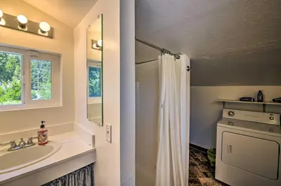 a bathroom with a sink and a shower at Secluded Camp Connell Home with Deck and Fireplace! in Camp Connell