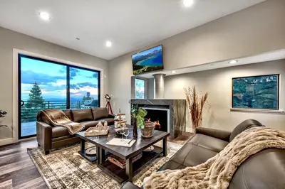 a living room with couches and a fireplace at LUXE 15 Blue Diamond Lodge Lake Tahoe Hot Tub in Stateline