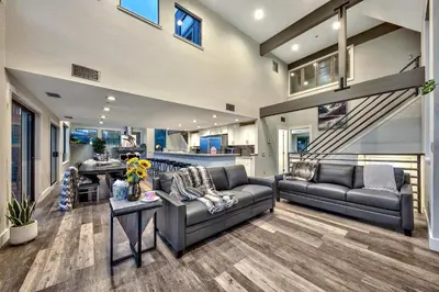 a living room with two couches and a table at LUXE 4 Blue Diamond Lake Tahoe Lodge in Stateline