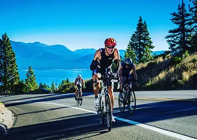 a group of people riding bikes down a road at LUXE 4 Blue Diamond Lake Tahoe Lodge in Stateline
