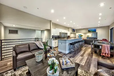 a living room with a couch and a table at LUXE 11 Blue Diamond Lodge Lake Tahoe in Stateline