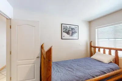 a bedroom with a bed and a window at Papas Mountain in Shaver Lake