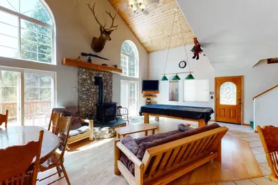 a living room with a couch and a table at Papas Mountain in Shaver Lake