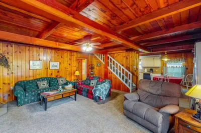 a living room with a couch and a chair at Maul Cabin in Shaver Lake