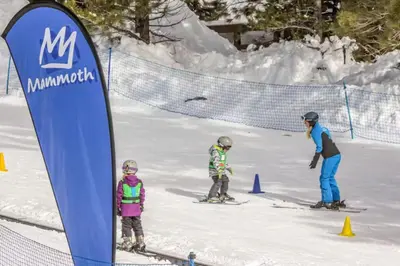 a group of three people skiing in the snow at Forest Creek 26 in Mammoth Lakes