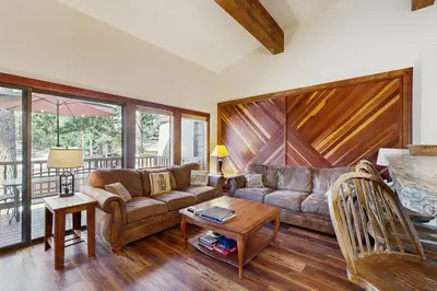 a living room with a couch and a table at Private Beach Retreat in Zephyr Cove