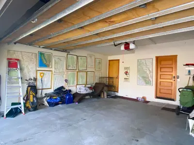 a room with luggage and maps on the walls at Snowcreek #760 condo in Mammoth Lakes