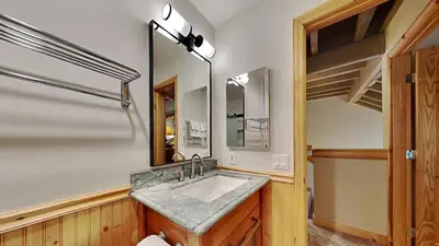 a bathroom with a sink and a mirror at Beautiful 2 BR with 2 Lofts SLOPESIDE! in Mammoth Lakes