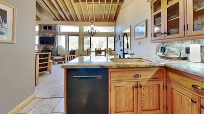 a kitchen with a sink and a dishwasher at Beautiful 2 BR with 2 Lofts SLOPESIDE! in Mammoth Lakes