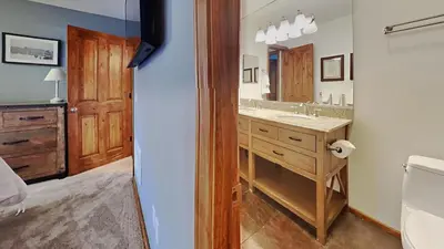 a bathroom with a sink and a mirror at Spacious 4 Bed 3 Bath Condo Great For Families! in Mammoth Lakes