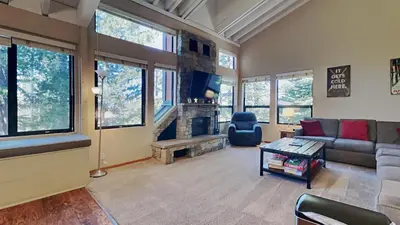 a living room with a couch and a fireplace at Spacious 4 Bed 3 Bath Condo Great For Families! in Mammoth Lakes