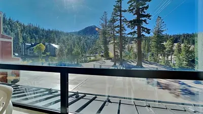 a glass balcony with a view of a mountain at Amazing 2 Bedroom Condo with Awesome View! in Mammoth Lakes