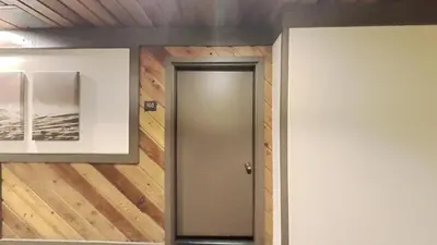 a door in a room with wood paneling at One Bedroom Condo Close To Canyon Lodge! in Mammoth Lakes