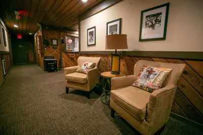 a living room with two chairs and a lamp at One Bedroom Condo Close To Canyon Lodge! in Mammoth Lakes
