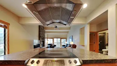 a kitchen with a stove top oven in a room at Beautifully Remodeled 4 Bedroom Home in Mammoth Lakes