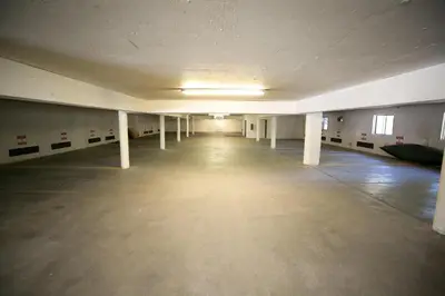an empty room with columns and a long hallway at Spacious One Bedroom Condo with Full Kitchen! in Mammoth Lakes