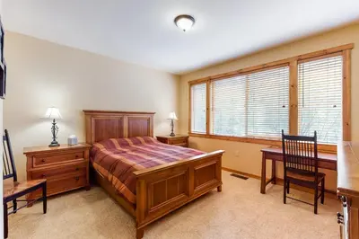 a bedroom with a bed and a desk at Comfortable and Convenient Truckee Condo in Truckee