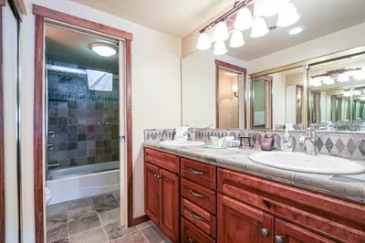a bathroom with two sinks and a shower at Silver Bear #22 condo in Mammoth Lakes