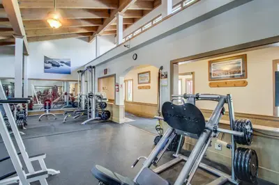 a gym with several treadmills and weights at Delightful Northstar Condo in Kingswood Estates