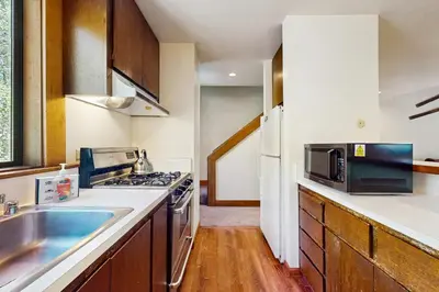 a kitchen with a sink and a microwave at Delightful Northstar Condo in Kingswood Estates
