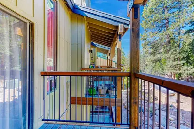 a balcony of a house with a wooden railing at Kings Run Relaxation in Kings Beach