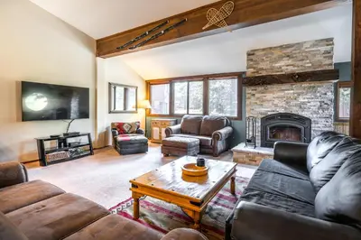 a living room with a couch and a fireplace at Helios S # 5 in Mammoth Lakes