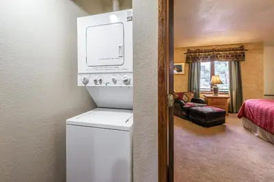 a bathroom with a washer and dryer in a room at Helios S # 5 in Mammoth Lakes