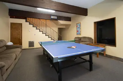 a living room with a ping pong table in it at Helios S # 5 in Mammoth Lakes