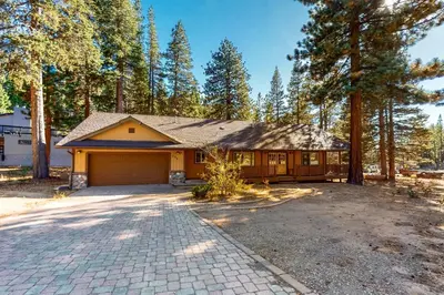 a house with a garage and a driveway at Makoto in Stateline