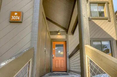 a orange door on the side of a building at Enjoyable Northstar Condo in Kingswood Estates