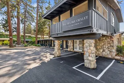 a building with a balcony on the side of it at South Lake Chalet by Heavenly in South Lake Tahoe