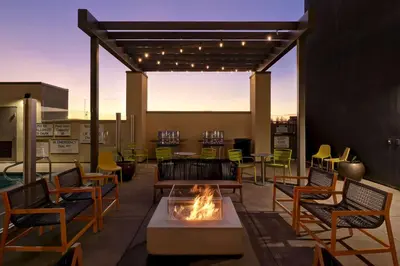 a patio with a fire pit and tables and chairs at Home2 Suites By Hilton Turlock, Ca in Turlock