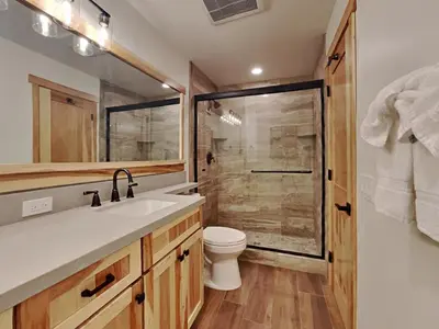 a bathroom with a toilet and a sink and a shower at Spacious 3 BR Condo with Loft in Mammoth Lakes