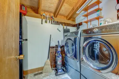 a washer and dryer in a tiny house at Cheery Gold Bend Family Condo in Truckee